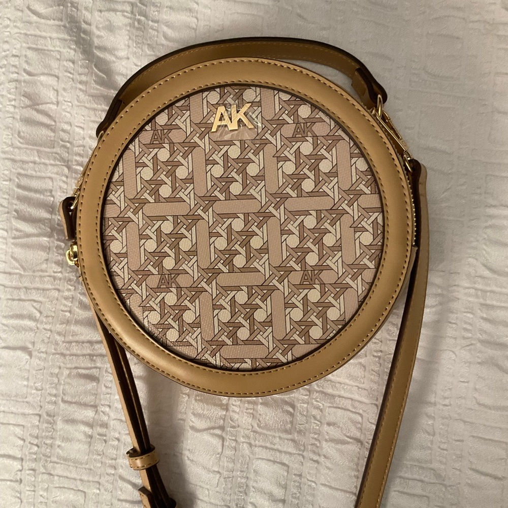 Anne Klein tan, round, crossbody purse. New